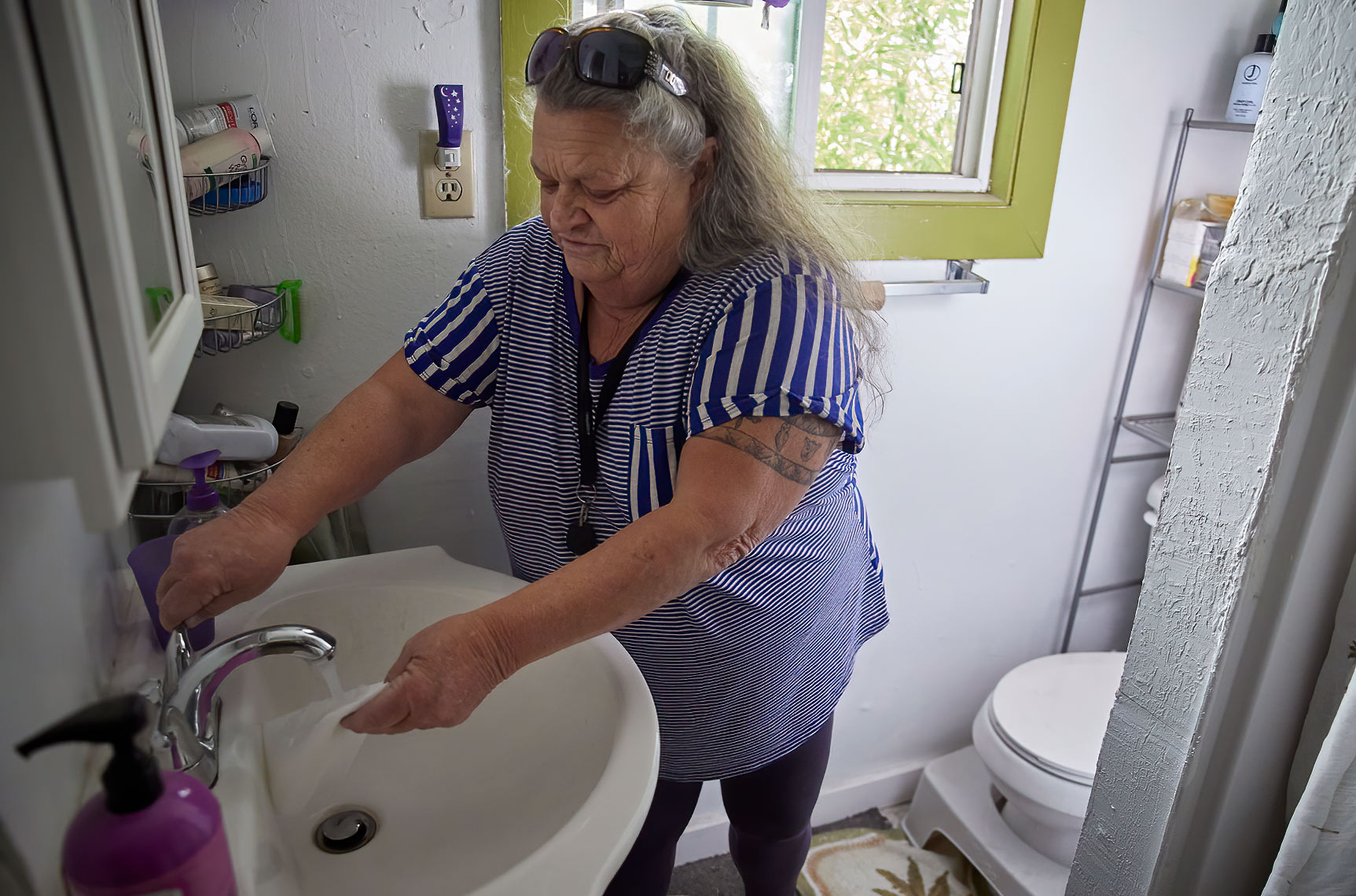 Woman Cleans Particulate Matter From Her Home