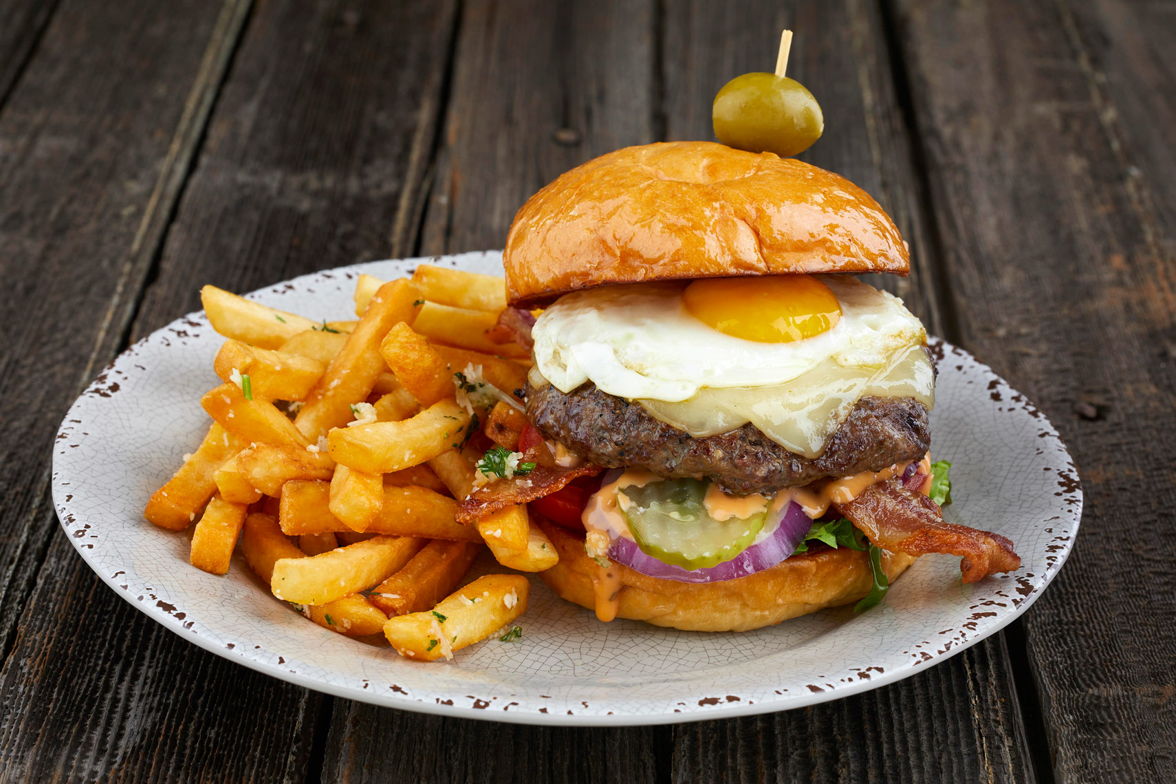 Bacon Cheeseburger With Fried Egg and French Fries