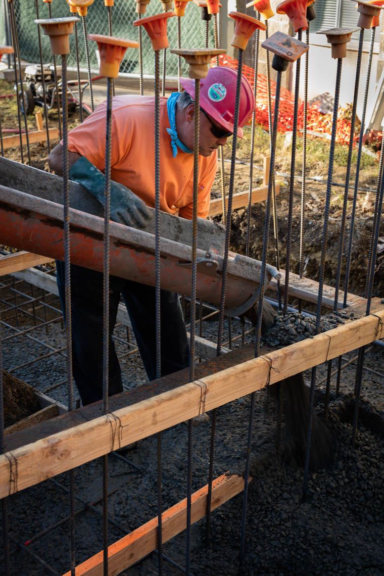 Construction Worker Pouring Concrete