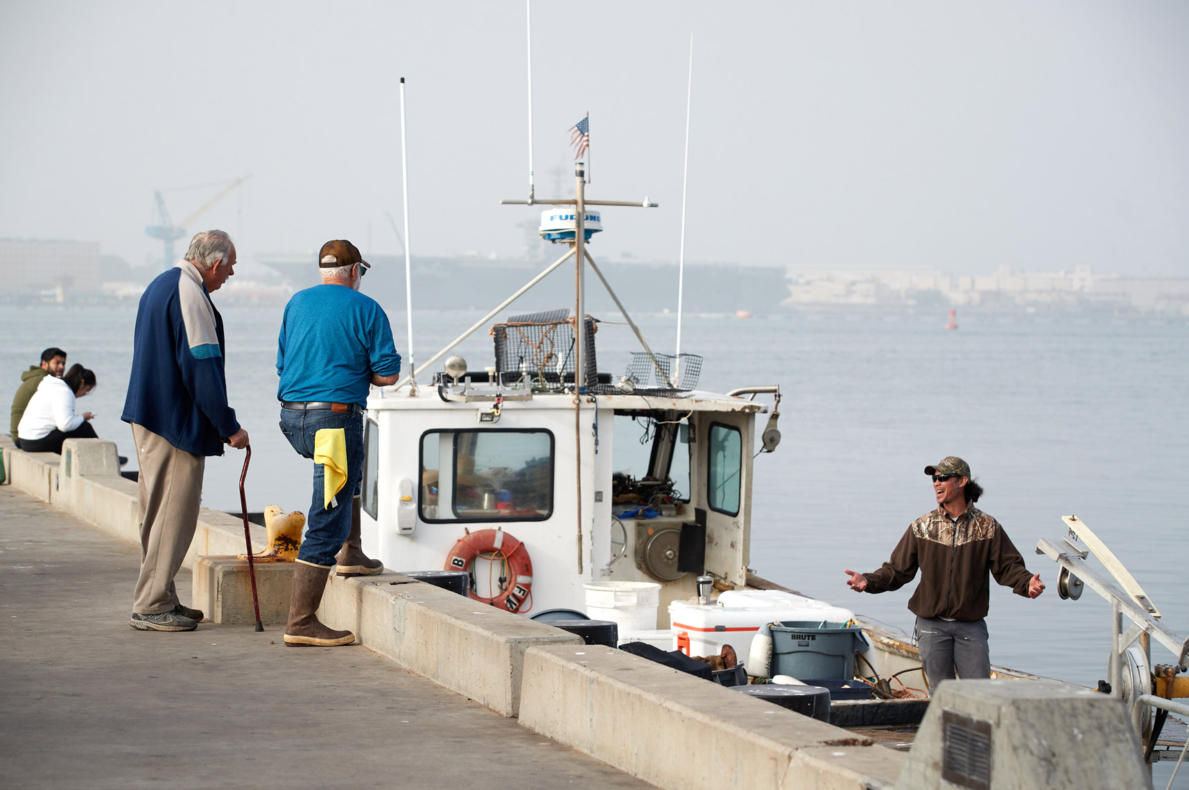 Fishermen Talk After Dropping off Their Catch at Tuna Harbor