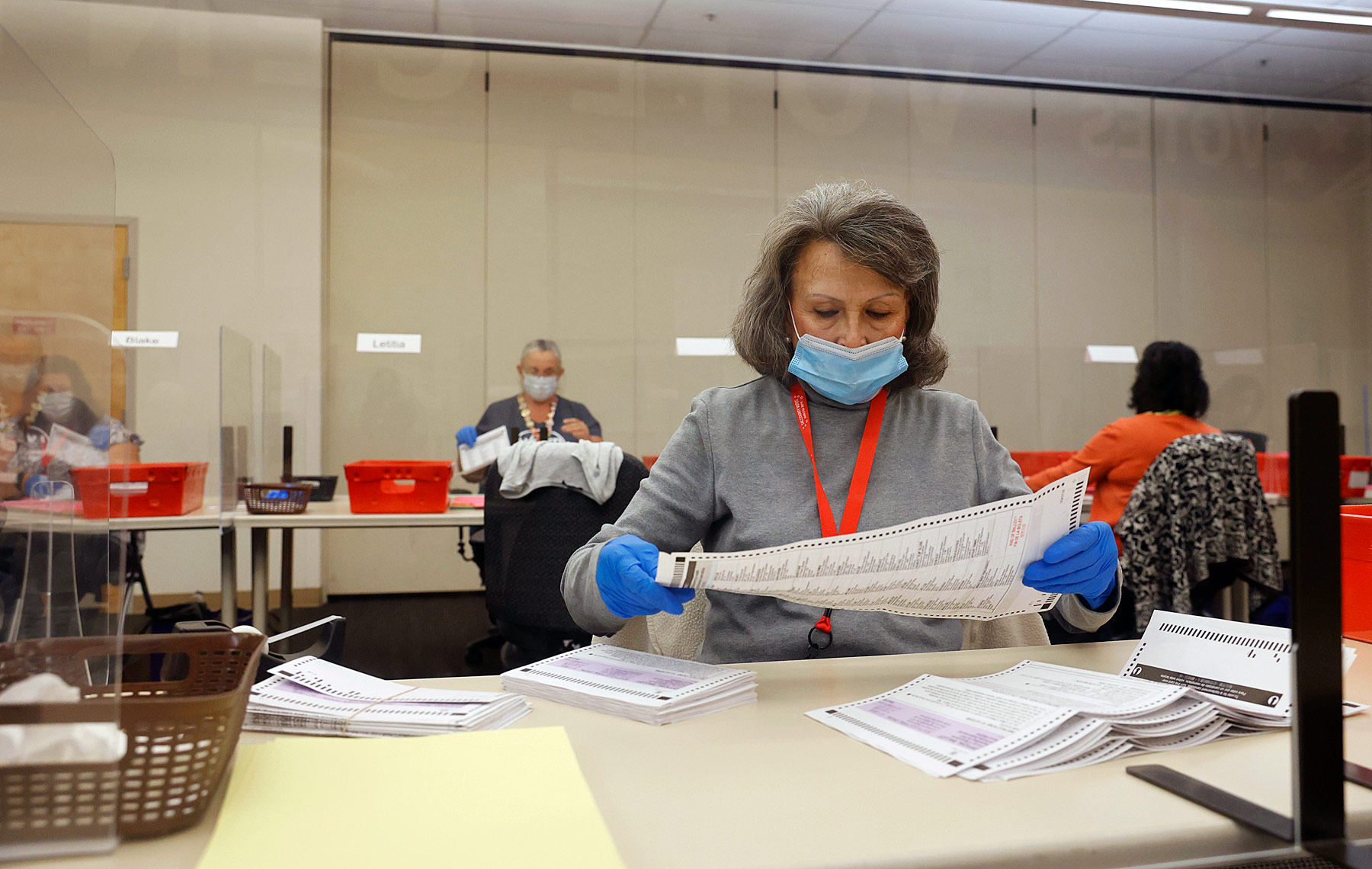 Election Worker Inspects Ballots